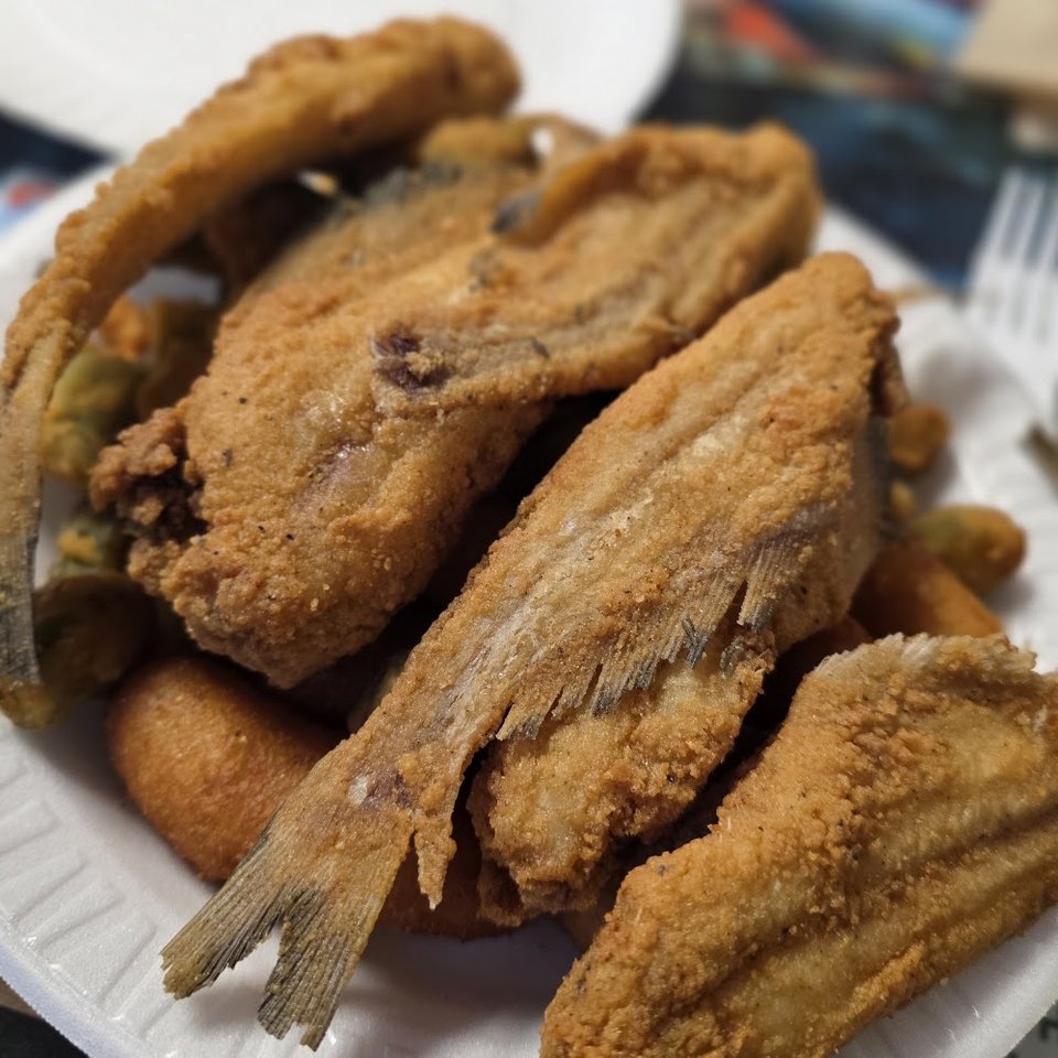 Simple menu showing seafood favorites and sides.